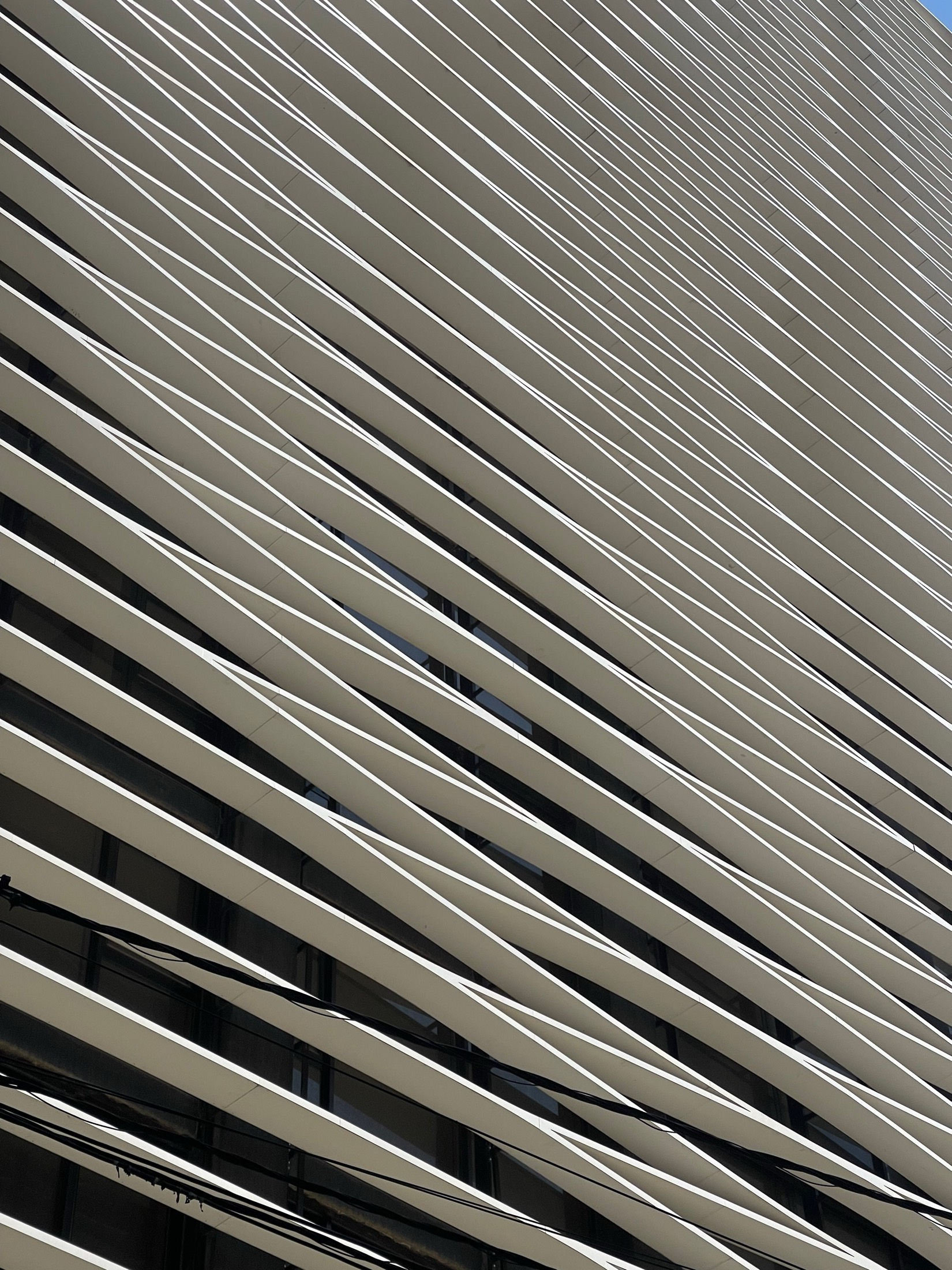 Rows of angled white fins across the face of a building in Beirut
