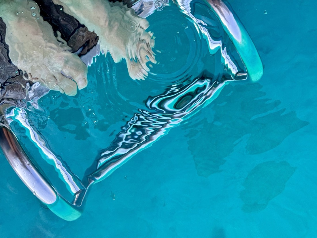 Abstract shapes and light in clear blue water