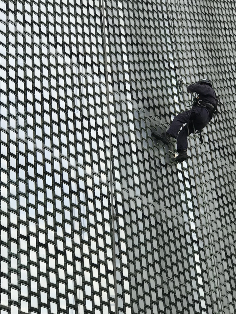 Person climbing a large rope net