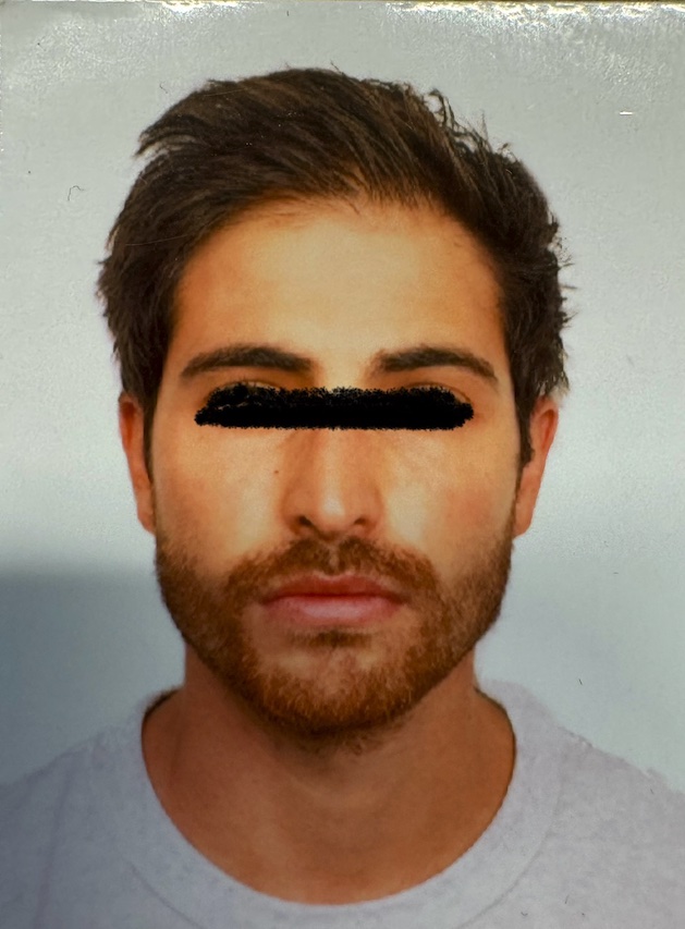 Felix Specter, passport photo with the eyes blacked out